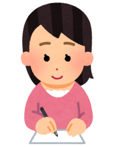 お礼状を書くために机に向かっている学生