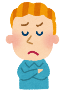 宛名の書き方に悩んでペンを持って止まっている人